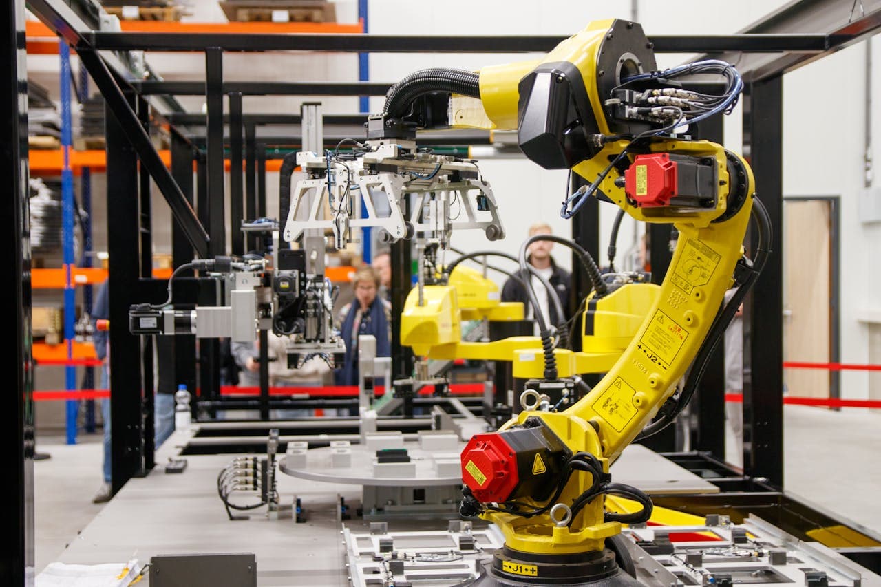 Industrial robot arm in precision engineering facility — Rudrani Mechatronics website by Freelancer.company